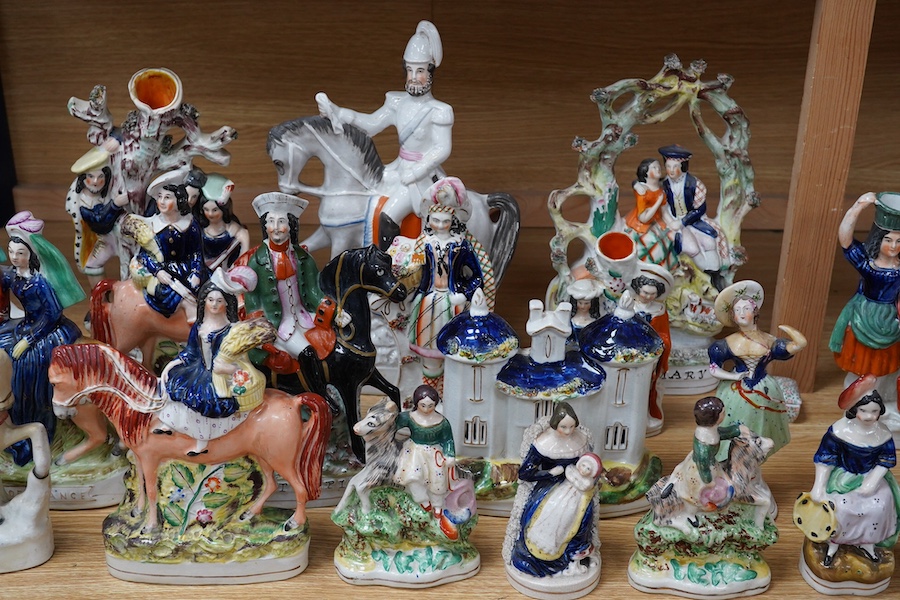 A collection of twenty Staffordshire flatback figures or models to include D. Turpin and Empress of France, largest 36cm high. Condition - fair, some restored